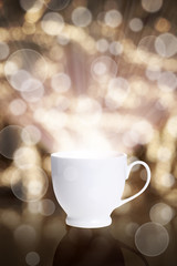 Obraz na płótnie Canvas coffee cup against bokeh background