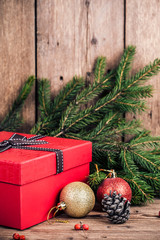 Fototapeta na wymiar gift box with christmas elements on wooden background