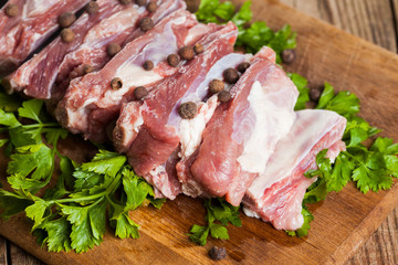 Raw pork ribs on a cutting board