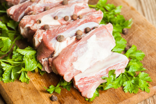 Raw pork ribs on a cutting board