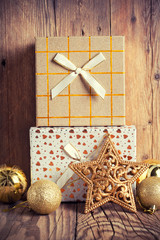 gift boxes with christmas decoration on wooden background