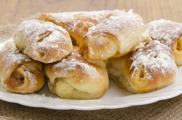 croissant with powdered sugar on a plate