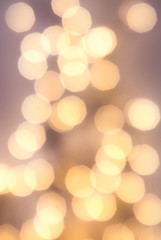 Obraz premium Abstract background with glowing magic bokeh, defocused holiday