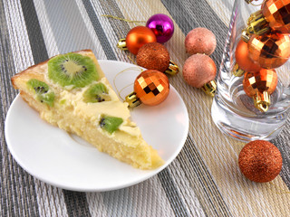 kiwi tasty cake with champagne wine bottle and christmas balls