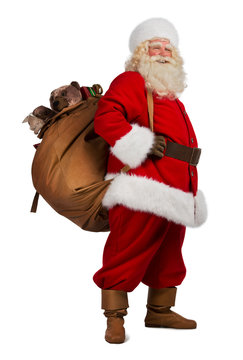 Real Santa Claus carrying big bag full of gifts