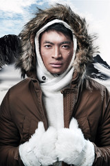Asian winter sport fashion man in snow mountain landscape. Weari - obrazy, fototapety, plakaty