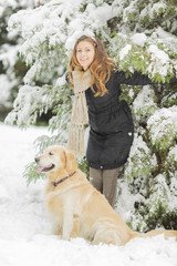 Young woman with dog at winter