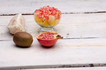 fruit salad, pomegranate, kiwi, orange, pomelo