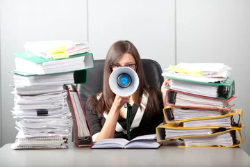 Business woman screaming with a megaphone © Pumba