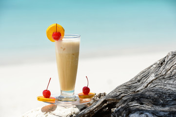 cocktail on the wood at the outdoor against tropic sea beach