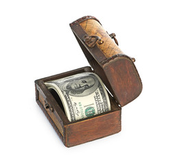 Dollar-bills in the old wooden treasure chest