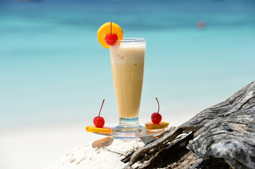 cocktail on the wood at the outdoor against tropic sea beach