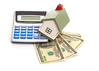 house sitting with a calculator and dollar