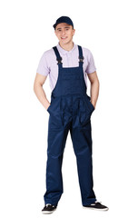Fototapeta premium Workman in blue overalls and peaked cap, isolated on white