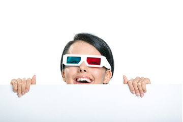 Girl in 3D spectacles peeps out from behind the copyspace