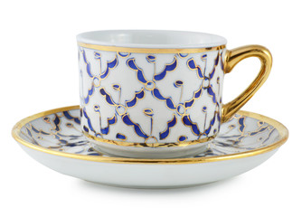 Cup and saucer on white background