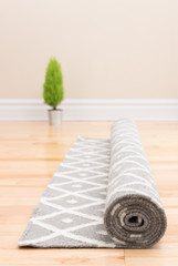 Unrolling carpet in a new home