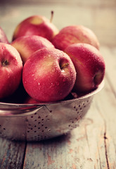 Ripe apples on a wooden table