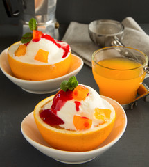 Ice cream in orange peel.