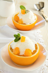 Ice cream in orange peel.