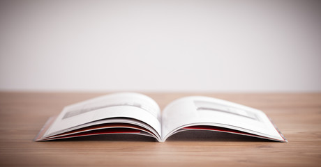 Open book on wooden deck