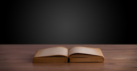 Open book on wooden deck
