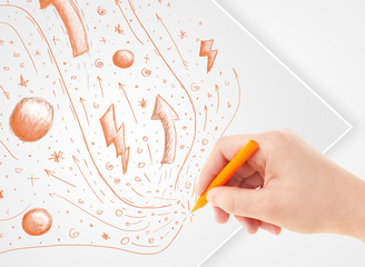 Hand drawing abstract sketches and doodles on paper