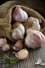 Garlic on a wooden background.