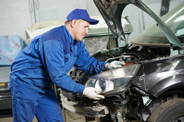 Fototapeta na wymiar auto mechanic at repair work