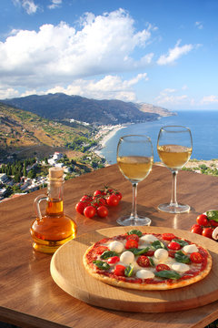 Fototapeta Sicily with pizza and white wine, Taormina, Italy