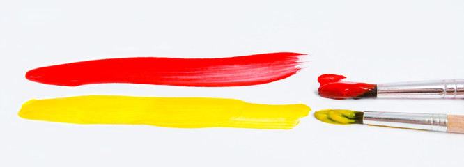Fototapeta premium Paint brushes and paint isolated on a white