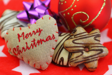 Merry Christmas on canvas heart, sweets and decorations