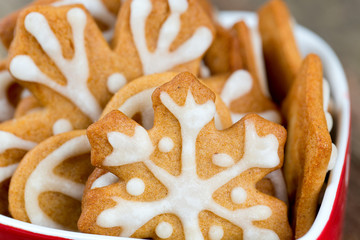 Decorated Christmas cookies in a beautiful red bowl