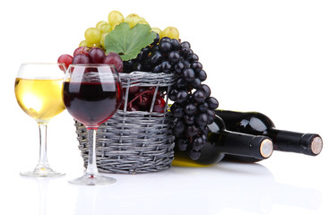 bottles and glasses of wine and grapes in basket, isolated