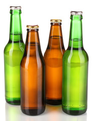 Coloured glass beer bottles isolated on white