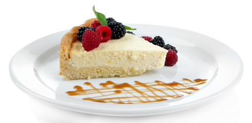 Slice of cheesecake  with berries and sauce
