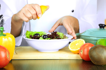 Cook hands prepare salad