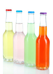 Drinks in glass bottles isolated on white