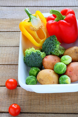 raw vegetables and cooking utensils