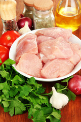 Raw turkey meat on wooden table close up