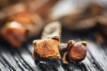 pile cloves on wood background