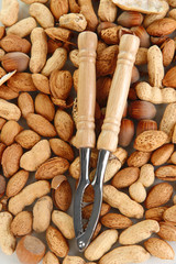 Nutcracker with nuts close-up background