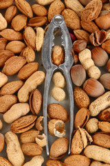 Nutcracker with nuts close-up background