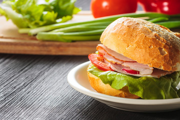Sandwich with fresh vegetables, cheese and ham