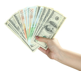 Female hand with dollars close up isolated on white