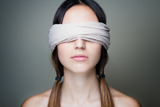 A Blindfolded Woman with Her Hands on Her Face · Free Stock Photo