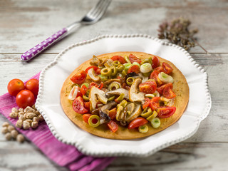 chickpeas focaccia with mushroom tomatoes olives,selective focus
