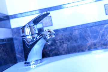 Ceramic sink with chrome fixture, close up