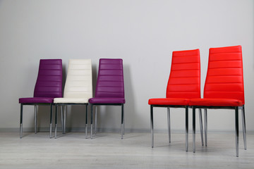 Obraz premium Modern color chairs on wall background