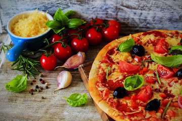 Pizza - Italian pizza with salami and black olives